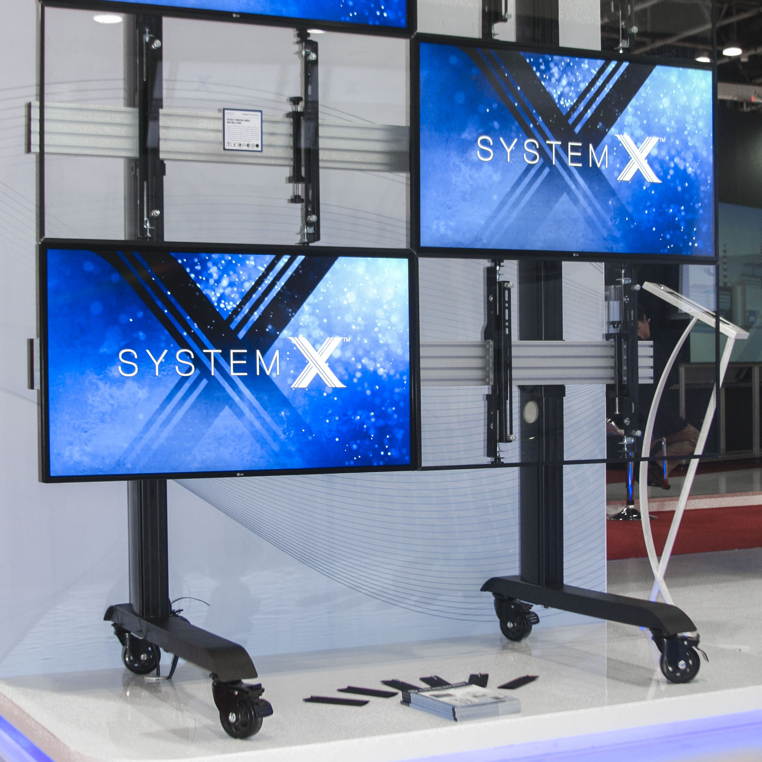 BT8371 System X universal mobile video wall stand in a 3x2 landscape configuration, holding LG 42&rdquo; screens